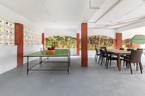 a dining room with a table and chairs at Charming house with private tennis court and pool in Catadau