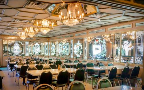 a large room with tables and chairs and chandeliers at Cute Private Room, near the Airport - Free parking - 02 in Miami