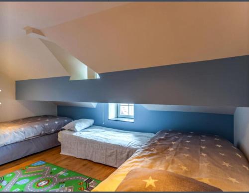 a bedroom with two beds in a room at Spacious castle with garden in Aywaille in Aywaille