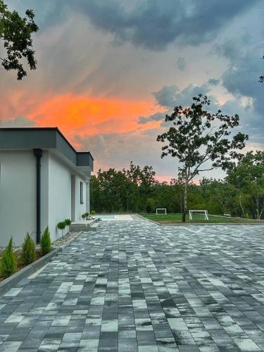 an empty parking lot in front of a building at Luxury Villa Mojito in Široki Brijeg