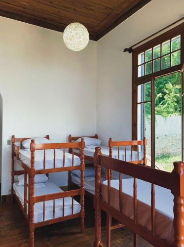 two bunk beds in a room with a window at Hostel Sunrise in Rio de Janeiro