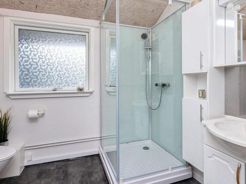 a bathroom with a shower with a glass door at Holiday home Vinderup XXVI in Vinderup
