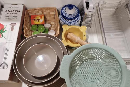 a drawer filled with dishes and other kitchen items at casa y piscina en un parque natural in Benicàssim