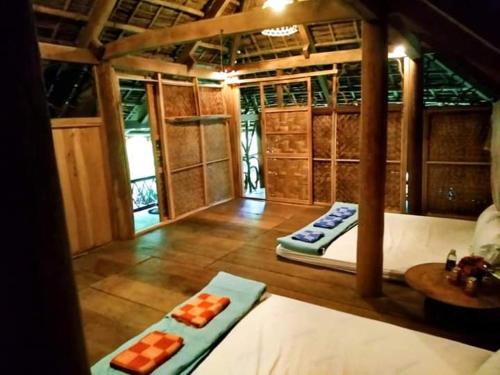 a room with two remote controls on the floor at Puluong homestay nacoLodge in Làng Chiêu