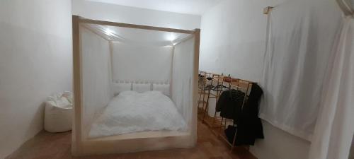מיטה או מיטות בחדר ב-Casa Tartaruga