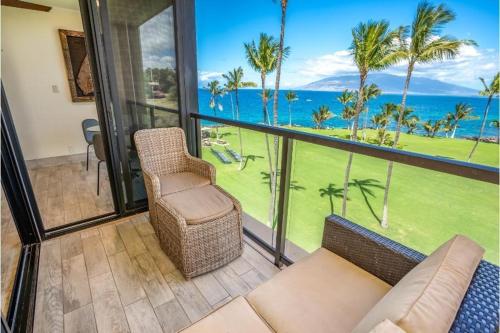 a living room with a view of the ocean at KIHEI SURFSIDE, #512 condo in Wailea