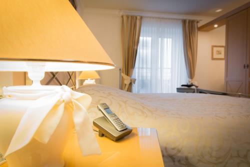 En eller flere senge i et værelse på Hotel Residenz