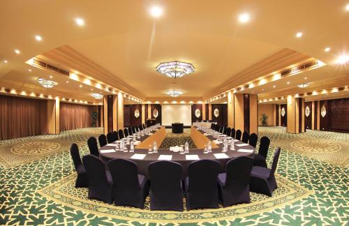 a large banquet hall with a long table in the middle at Pyramisa Suites Hotel Cairo in Cairo