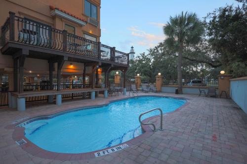 a large swimming pool in front of a hotel at Ocean Inn & Suites in Saint Simons Island