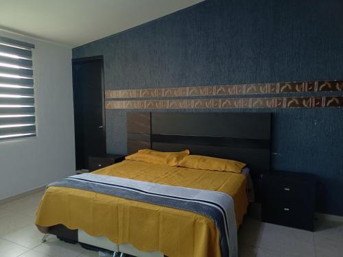 Ein Bett oder Betten in einem Zimmer der Unterkunft QUINTA SANTA BÁRBARA