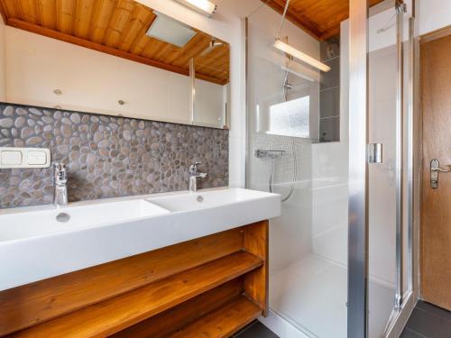 a bathroom with a sink and a shower at Chalet Kristall II in Grossarl