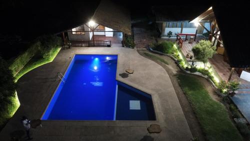an overhead view of a swimming pool at night at Quinta Suria in Quito