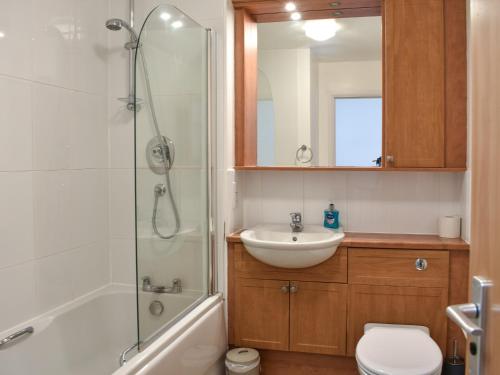 a bathroom with a shower and a sink and a toilet at Frater Place in Aberdeen