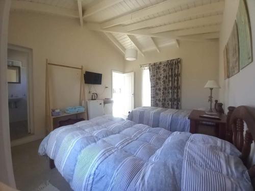 a bedroom with a large bed in a room at La Paula bed & breakfast in San Luis