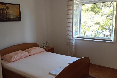 Ένα ή περισσότερα κρεβάτια σε δωμάτιο στο Apartments by the sea Lumbarda, Korcula - 22543