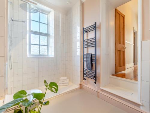 a bathroom with a sink and a mirror at Red House in Methwold