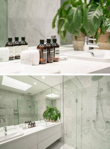 a bathroom with a sink and a mirror at Sophisticated art deco in the heart of Toorak in Melbourne
