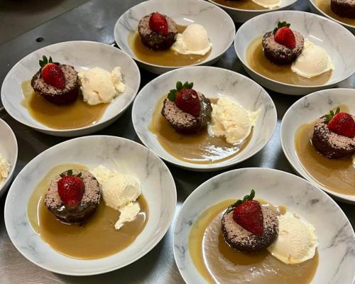 a group of plates of desserts on a table at The Commercial Hotel Wallerawang in Wallerawang