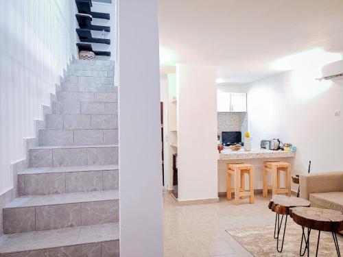 a living room and staircase in a house at Duplex Mbote Brazzavile in Brazzaville