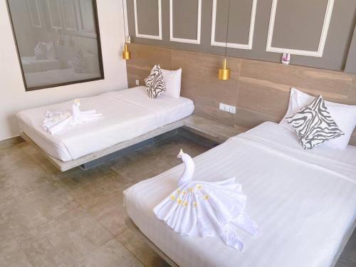 Cama ou camas em um quarto em Pyramid Hotel & Spa