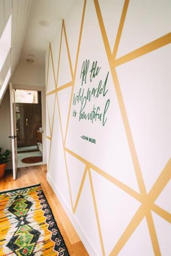 a room with a wall with a quote on it at Dunlap Hollow A-Frame in Rockbridge