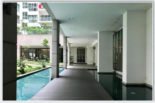 an external view of a building with a swimming pool at Regalia Studio in Kuala Lumpur
