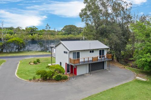 an aerial view of a house with a driveway at The Stag Cabin 4 in Mylestom