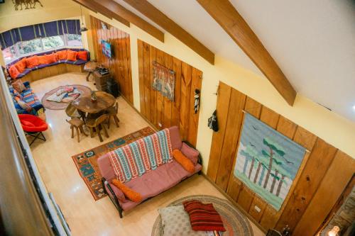 an overhead view of a living room with a couch and a table at Cozy Baguio House - Outlook Drive (DOT accredited) in Baguio
