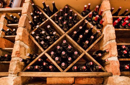 a bunch of bottles of wine in a cellar at Hotel & Art Kristiana in Saalbach Hinterglemm