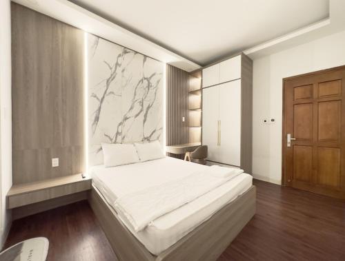 Postel nebo postele na pokoji v ubytování Lộc Thiên Ân hotel