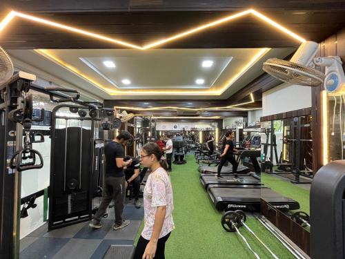 a group of people standing in a gym at Hotel Shri Radha Nikunj - Opposite Prem Mandir in Vrindāvan