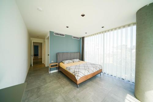 A bed or beds in a room at The Ni Villas Akyarlar - Bodrum