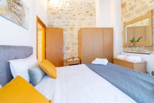 Postel nebo postele na pokoji v ubytování Asmani Apartments