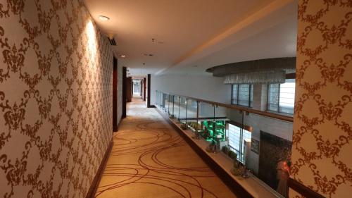 a hallway of a hotel with a room with a hallway at SkyCity Hotel Gurgaon in Gurgaon