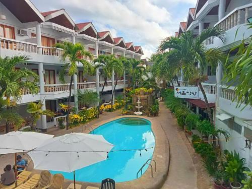 a view of a hotel with a swimming pool at Boracay Peninsula in Boracay