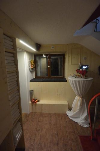 a bathroom with a bath tub and a window at Haus Erli in Mittenwald