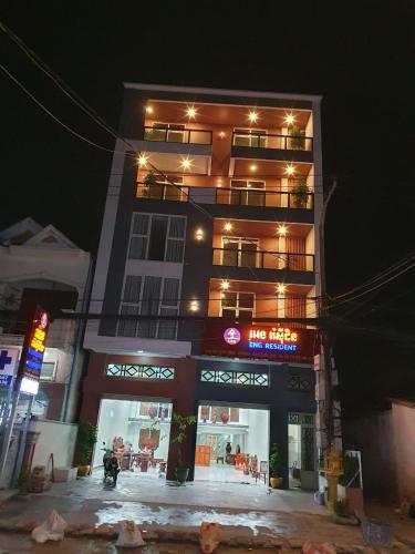 a tall building with lights on it at night at Eng resident guesthouse in Phnom Penh