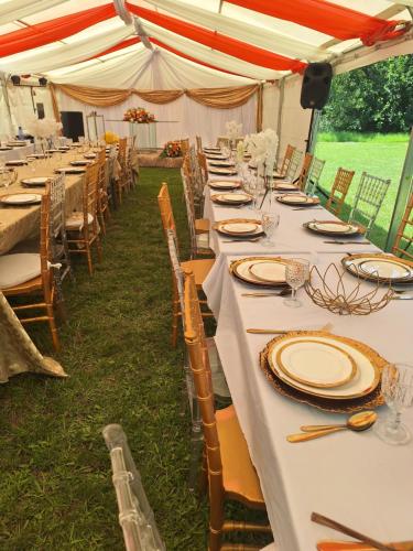 a long table set up for a wedding under a tent at 170 On Runnymead in Chartwell