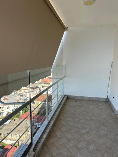 an empty balcony with a view of a city at ViaSaranda By ShqipTrip in Sarandë