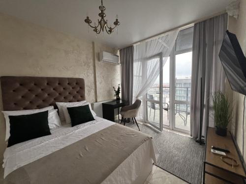 Кровать или кровати в номере Apartments VIP AVALON