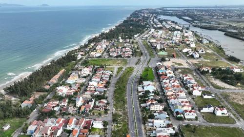 an aerial view of a city next to the ocean at Santa Sea Villa in Hoi An