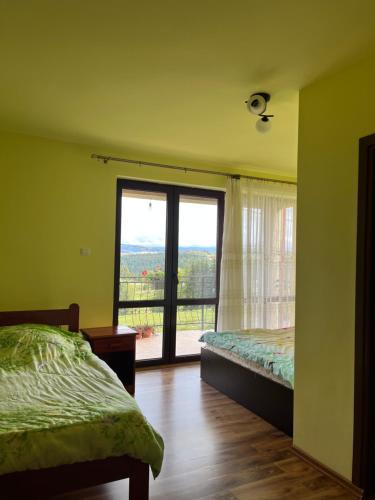 Postel nebo postele na pokoji v ubytování Casa Matis Mărișel