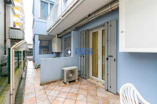 a balcony of a building with a door and a heater at Residence Adriatica in Lido di Jesolo