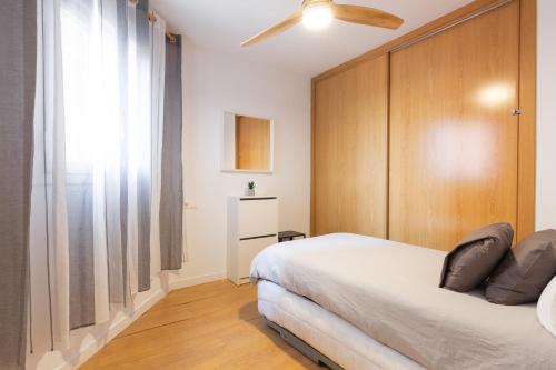 En eller flere senge i et værelse på Dormir en el Palo Beach Pets Friend