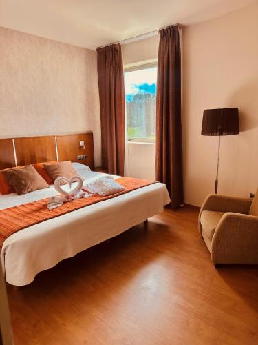 Hotel Spa Norat Torre Do Deza 4* Superiorにあるベッド