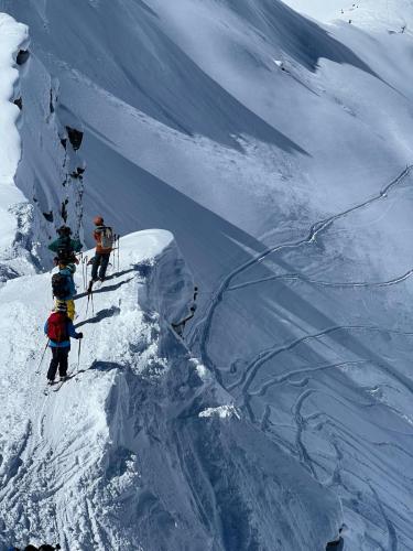 a group of people on top of a snow covered mountain at Le Bacchu Ber in Briançon