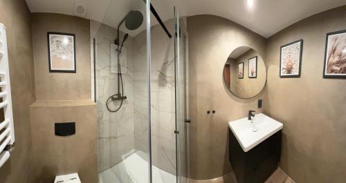 a bathroom with a shower and a sink at Agro na Wapniarni in Białla