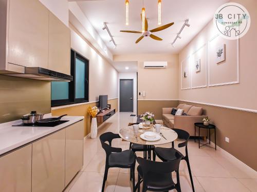 a kitchen and living room with a table and chairs at Skudai Paradigm Mall by RR JBcity in Johor Bahru