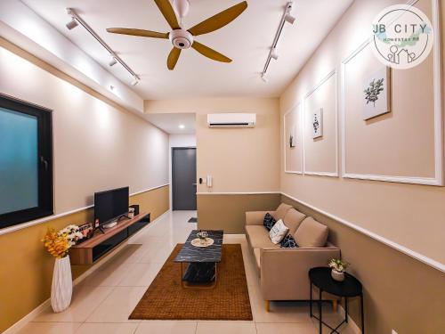 a living room with a couch and a flat screen tv at Skudai Paradigm Mall by RR JBcity in Johor Bahru