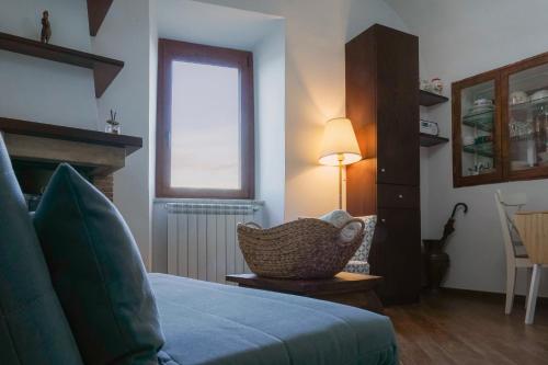 Le Rupi - Apartment tesisinde bir odada yatak veya yataklar
